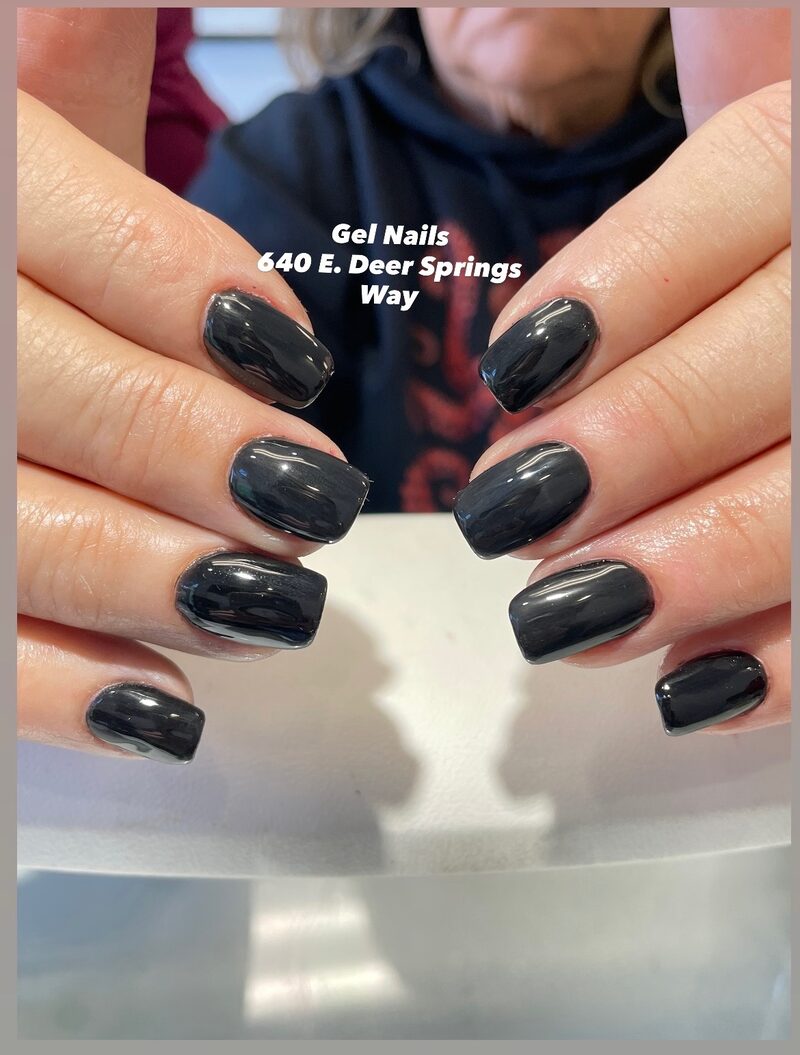 Glossy black gel nails with mirror-like finish
