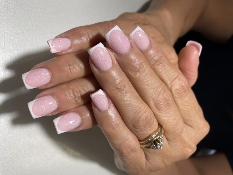 Pink shimmer square nails with crisp white french tips